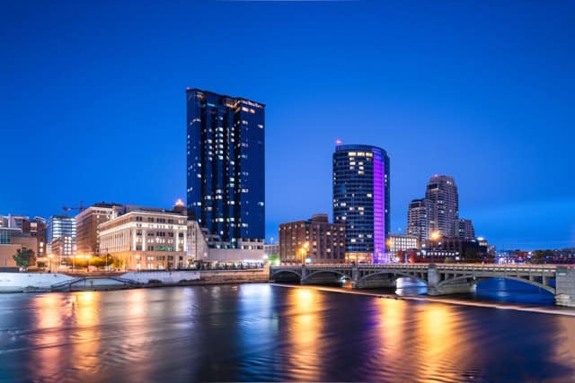 Grand Rapids, Michigan, downtown skyline on the Grand River at dusk.