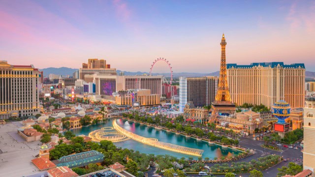 Aerial view of the Las Vegas skyline at sunset.