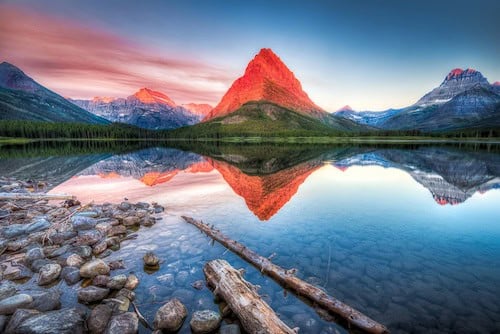 Stunning reflections on Swiftcurrent Lake in northern Montana