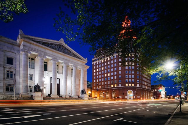 Buildings along Elm Street at night in downtown New Haven