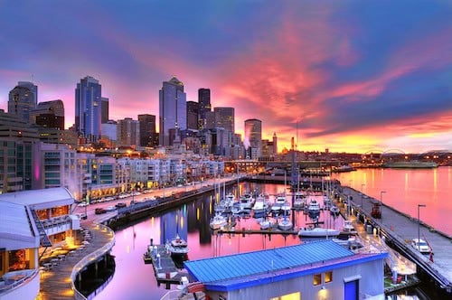 Seattle skyline dazzling under a beautiful dawn sky across pier-66 waterfront